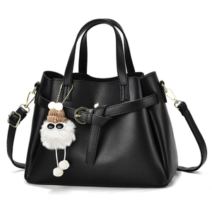 Black cross-body bag with bow pendant, layered texture, and removable shoulder strap