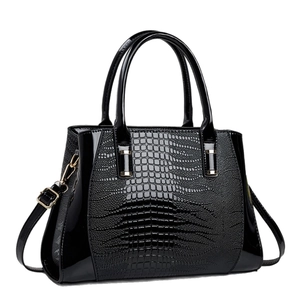 Large black handbag in crocodile pattern and glossy leather with gold hardware detail