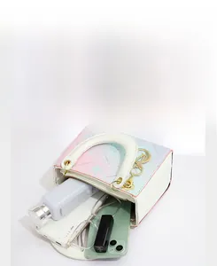 Detail view of the gradient tote bag showing interior space for cosmetics and phone