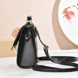 Retro black faux leather mini backpack with cute brown plush bear charm and gold metal hardware