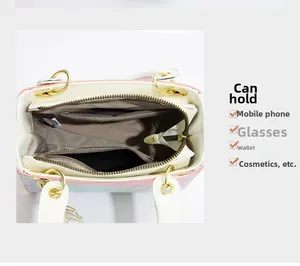 Spacious interior of gradient bucket bag with brown herringbone lining and zip pocket