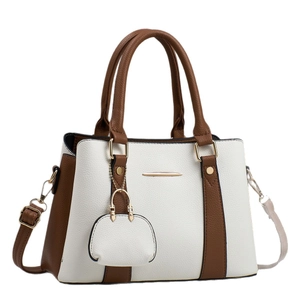 Women's luxury color-block tote bag in white litchi leather with brown handles and gold hardware