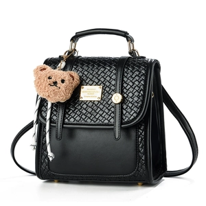 Minimalist black woven texture backpack with metal handle and cute bear charm