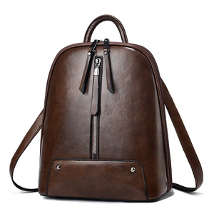 Vintage brown oil leather backpack for women with vertical zippers and metallic rivets