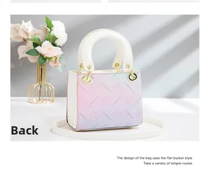 Detail view of the floral gradient back design on this white leather handbag