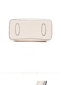 Detail view of the reinforced bottom with protective leather pads for the women's handbag
