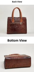 Dettaglio della borsa in pelle marrone coccodrillo con zip posteriore e base piatta