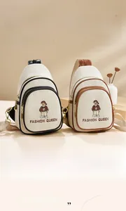 Detail of canvas chest bags with cartoon bear embroidery and fashion queen lettering