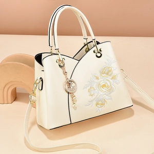 Cream white handbag with floral embroidery and gold hardware for women