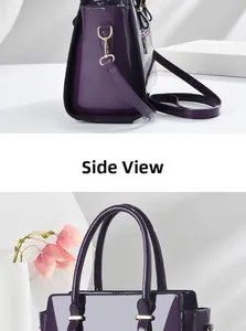Detail view of purple patent leather handbag with glossy finish and gold hardware hooks