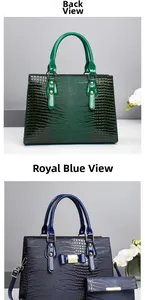 Detail view of crocodile pattern tote bag set with glossy finish and gold metal accents