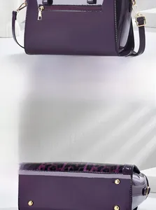 Detail of purple patent leather bag featuring leopard print base and gold metal feet