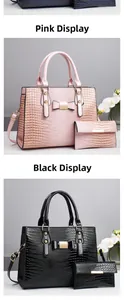 Detail of crocodile embossed handbag set with metallic bow and matching long wallet
