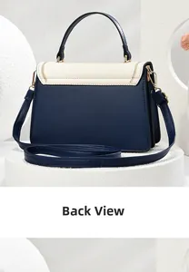 Back view of a chic color-block handbag with navy leather and cream white flap details
