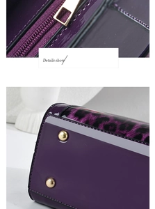 Detail of purple patent leather bag showing gold zipper and bottom protective studs
