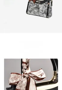 Detail of a vintage floral print handbag featuring a silk scarf bow and metal logo