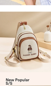 Detail of canvas crossbody bag with teddy bear embroidery and golden hardware