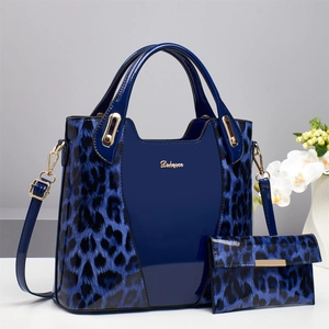 Deep blue leopard print glossy leather handbag set with matching clutch and gold hardware