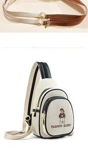 Detail of canvas chest bag featuring bear embroidery and adjustable mixed shoulder strap