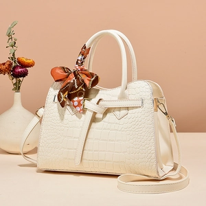 Elegant beige faux crocodile handbag with top handles, silk scarf and detachable strap