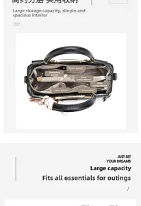 Internal view of the spacious handbag showing zipper pockets and multi-layer storage