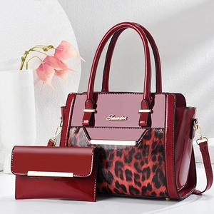 Deep red leopard print patent leather handbag set with matching wallet and gold hardware