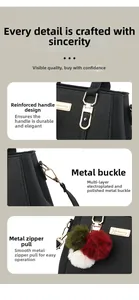 Detail view of reinforced handles and polished gold hardware on black pebble leather handbag