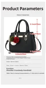Detail view of black lychee grain leather handbag with metal turn-lock and pompom charm