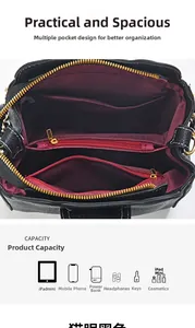 Top view of black bucket bag interior showing multiple compartments and claret red lining