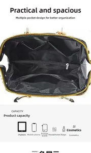 Detailed interior of large black handbag showing multiple compartments for iPad and makeup
