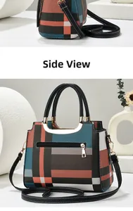 Detail view of plaid tote bag with U-shaped gold handles and orange blue color block