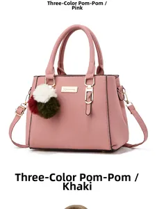 Pink faux leather handbag with triple-color pompom charm and adjustable strap