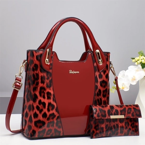 Red leopard print tote bag and wallet set with glossy finish and shoulder strap