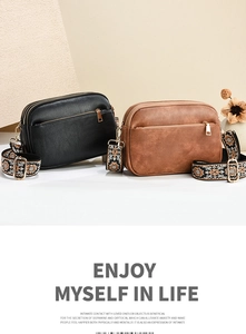 Detail of lychee texture crossbody bags in black and brown with ethnic woven wide straps