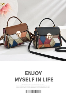 Detailed close-up of textured leather patchwork and gold metal buckle on fashion handbags