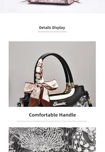 Close-up of black leather handles with silk scarf and high-quality stitching detail