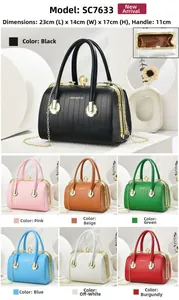 Detailed view of quilted PU leather handbag with gold metal frame and pearl clasp