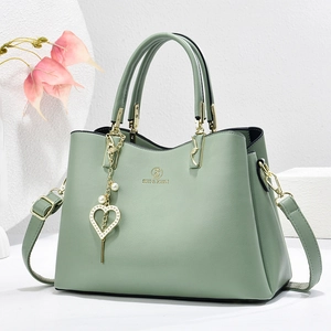 Sage green soft leather tote bag for women with golden heart pendant and pearl detail