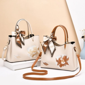 Fashionable floral embroidered tote bags with silk scarf details and shoulder straps