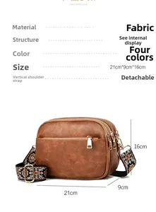 Detail view of retro brown crossbody bag with ethnic style embroidered shoulder strap