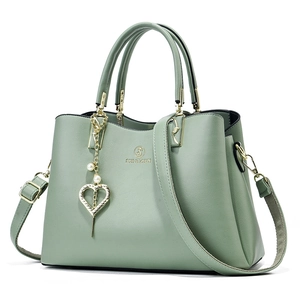 Pea green minimalist leather tote bag for women with pearl heart charm and strap