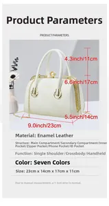 Detailed internal structure of white patent leather handbag with gold clasp and pearl charm