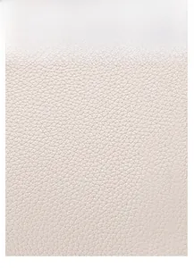 Close-up of cream leather bag showing detailed embossed crocodile texture and fine grain