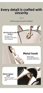 Detail view of lychee pattern leather handbag handles and golden Mickey hardware pendant