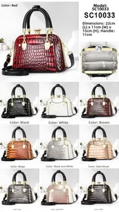 Macro detail of glossy crocodile texture shell handbags in multiple colors and hardware