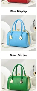 Close-up of pastel hand bags showing vertical quilting, pearl clasp, and metal chain straps
