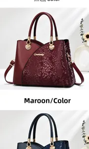 Detailed close-up of dark red and navy blue bags with snake pattern and gold hardware