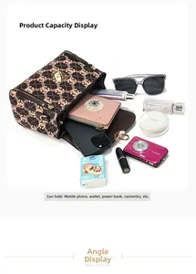 Top view of open barrel crossbody bag showing spacious interior with daily essentials