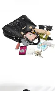 Top view of large capacity black tote bag showing organized daily essentials storage