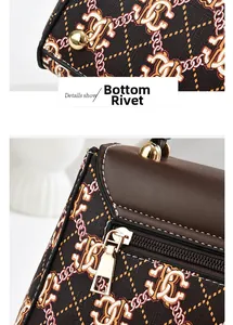 Detail view of the bag's gold metal bottom rivets and zipper with chain print